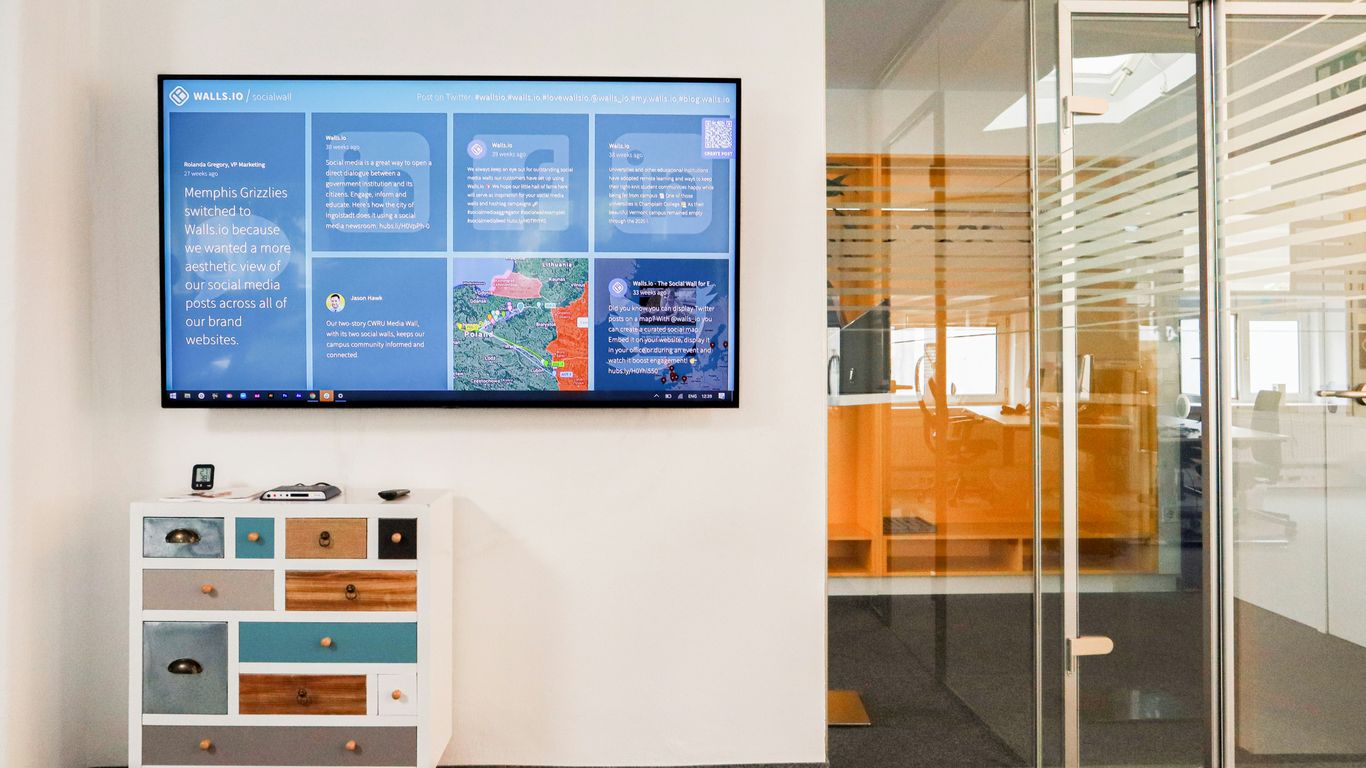 a television mounted to a wall in a room