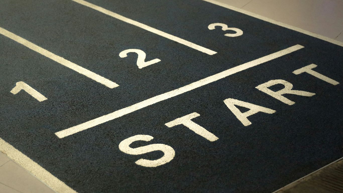 a close up of a street sign on the ground
