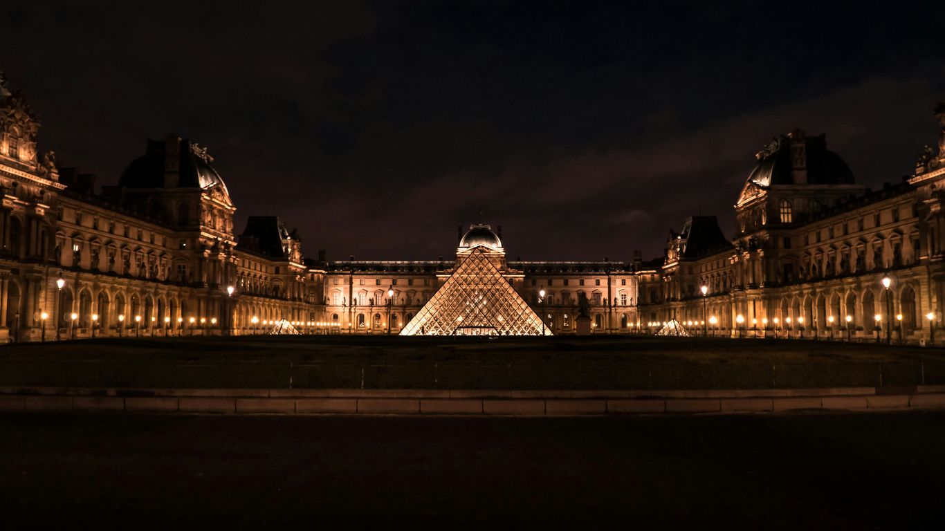 people walking on bridge during night time