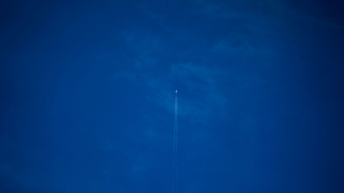 white light bulb on blue sky