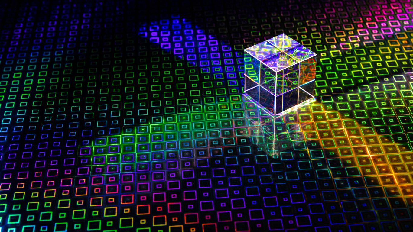 a colorful cube with a bright light coming out of it