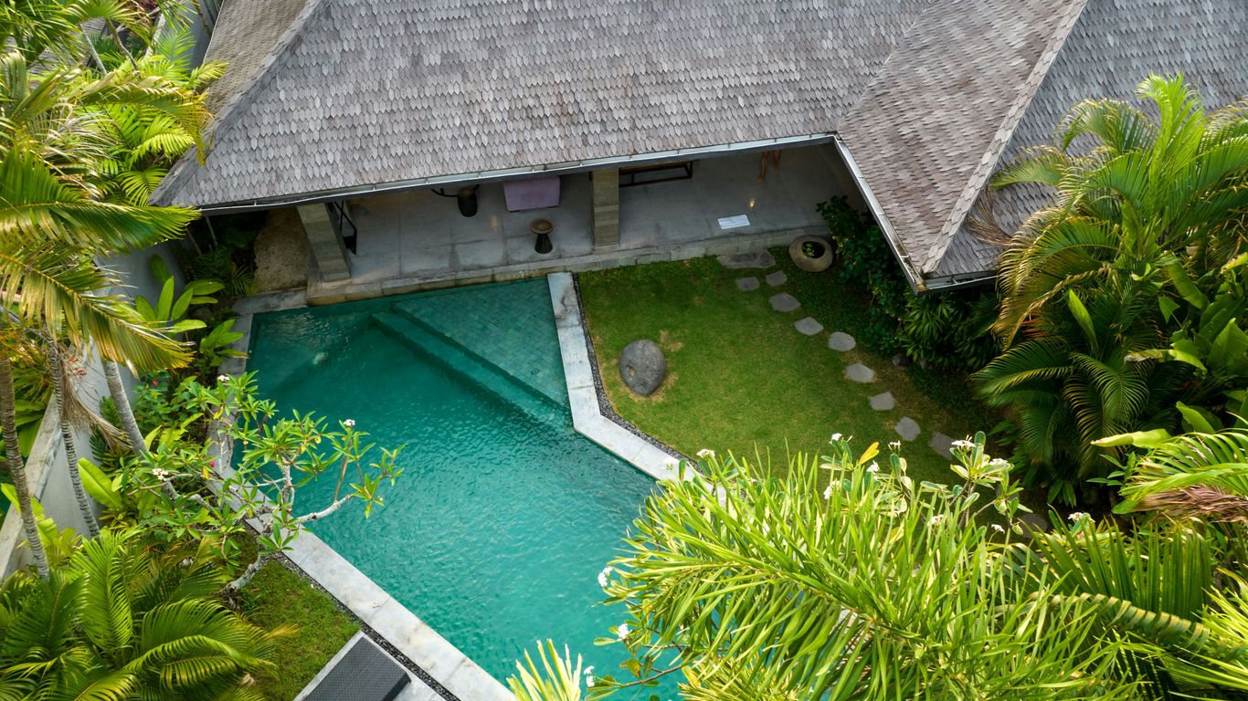 A bird's eye view of a house in the jungle