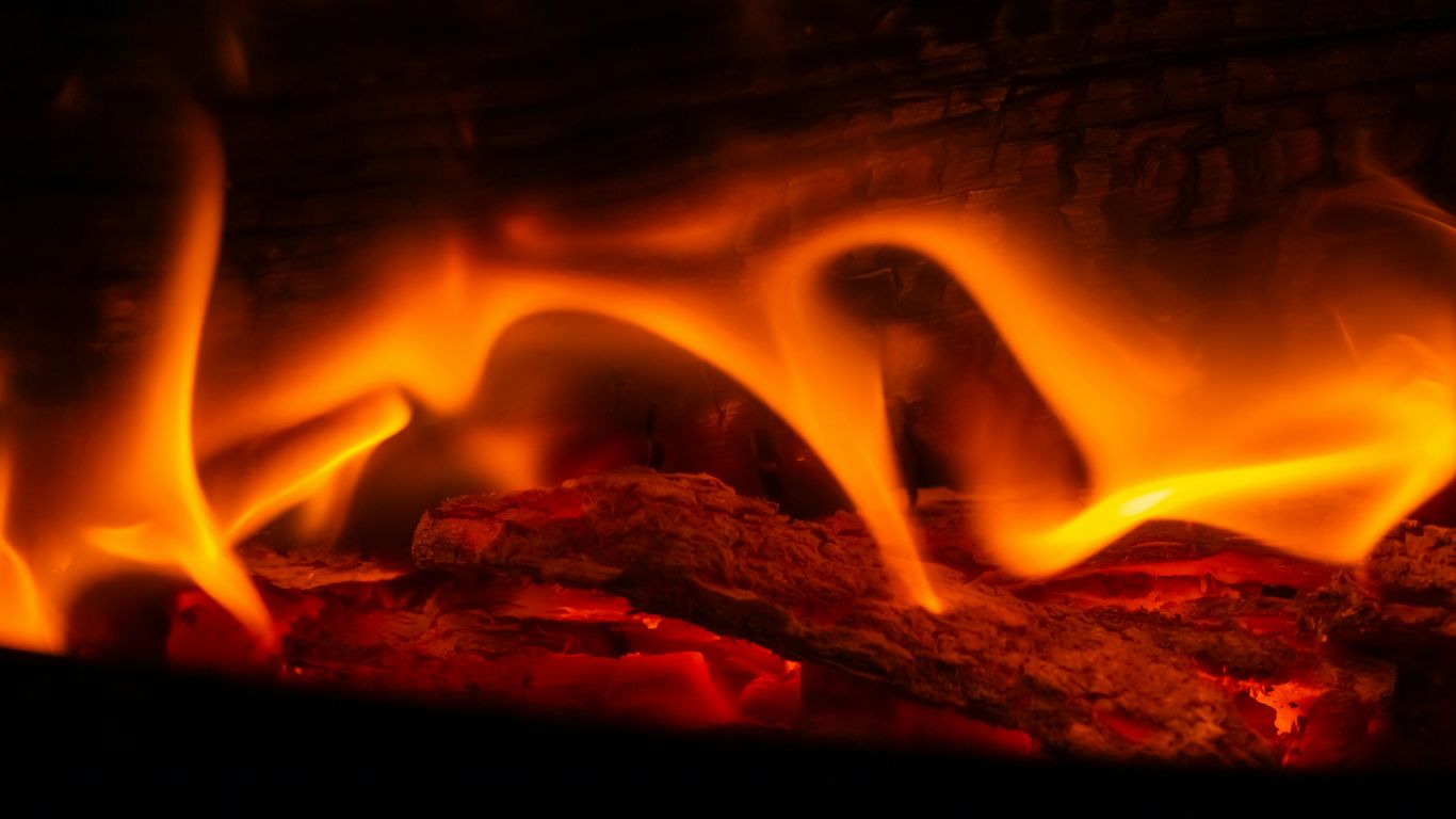 A close up of a fire burning in a fireplace