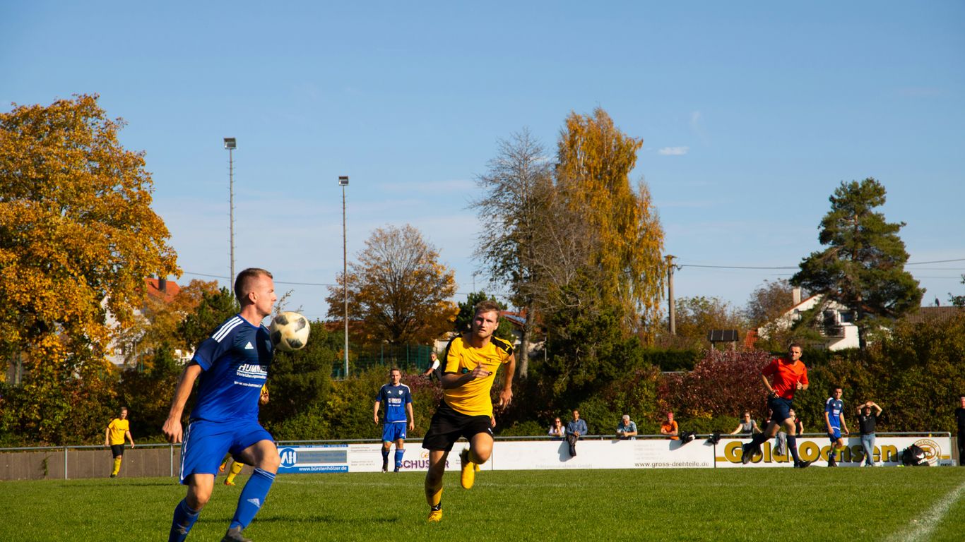 man wearing blue soccer jersey