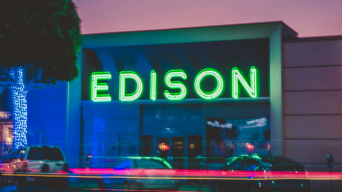 three vehicles parked in front of Edison building