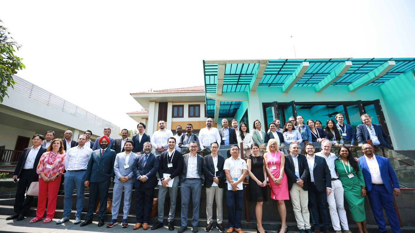 A large group of people standing together outdoors.