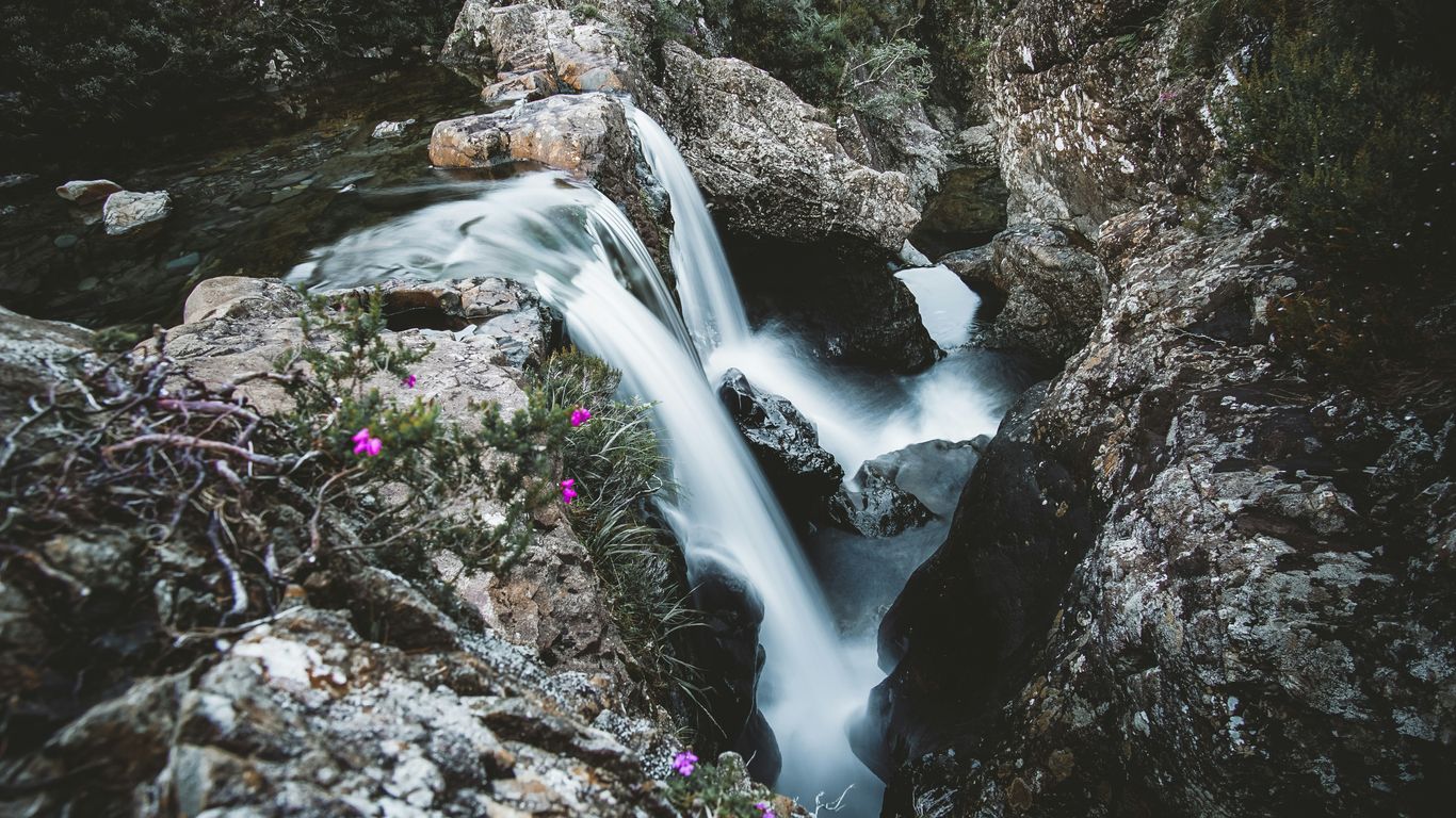 a stream of water flowing over rocks