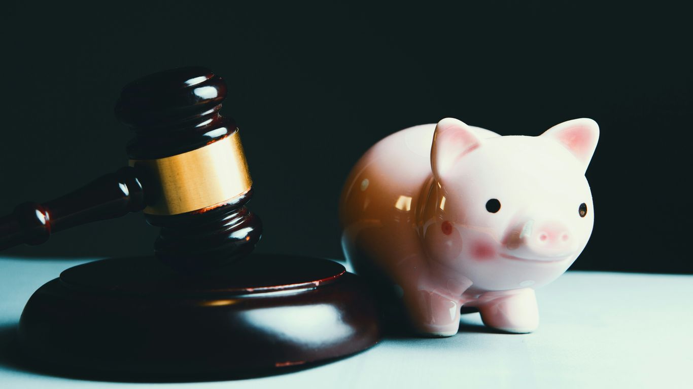 pink pig ceramic figurine on black and white round plate