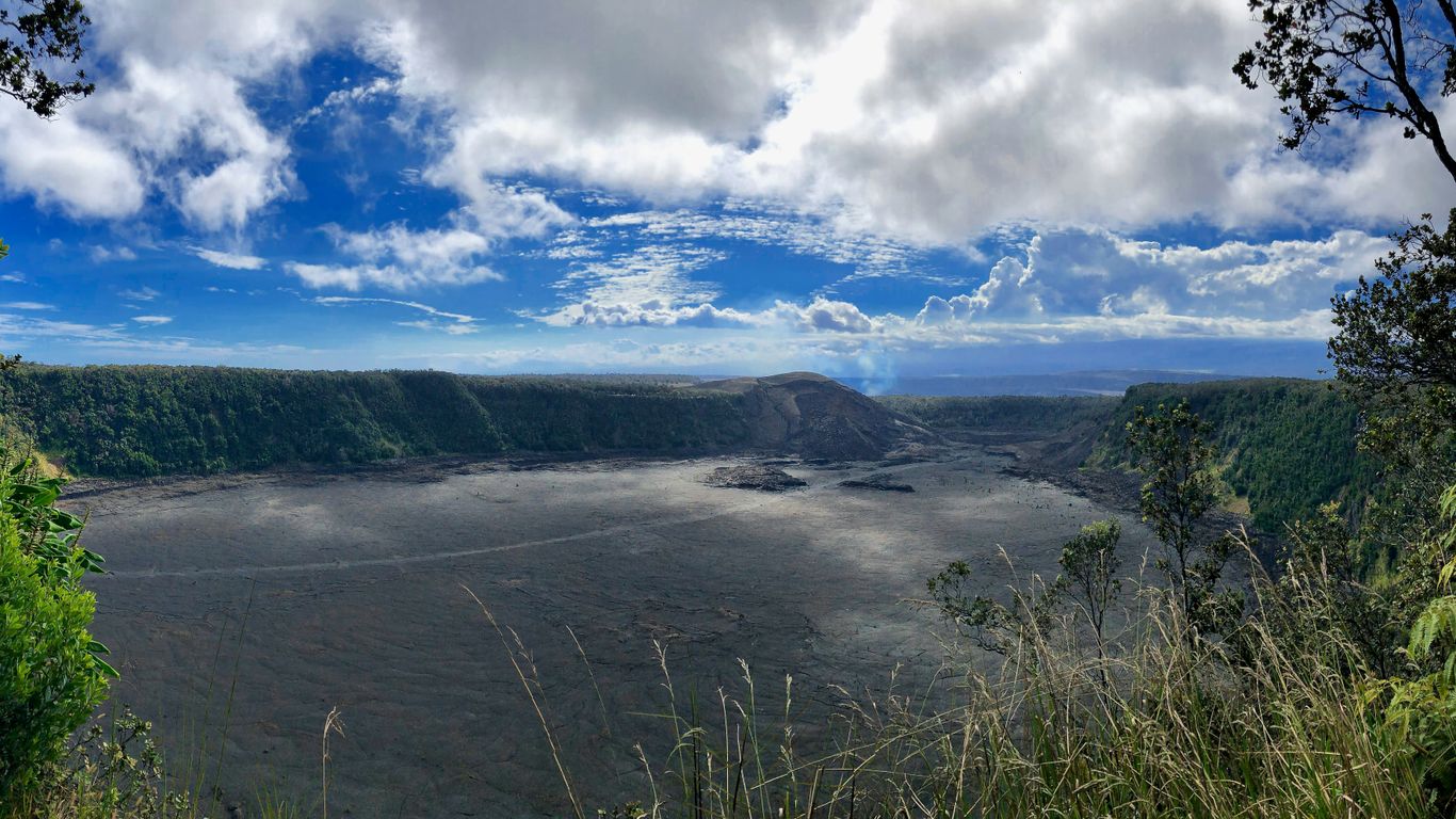 a scenic view of a lake surrounded by trees