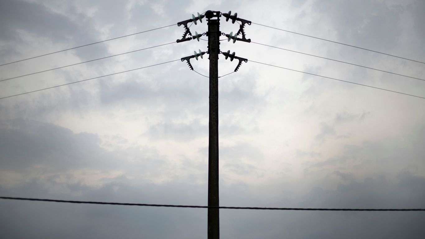 a telephone pole with power lines in the background