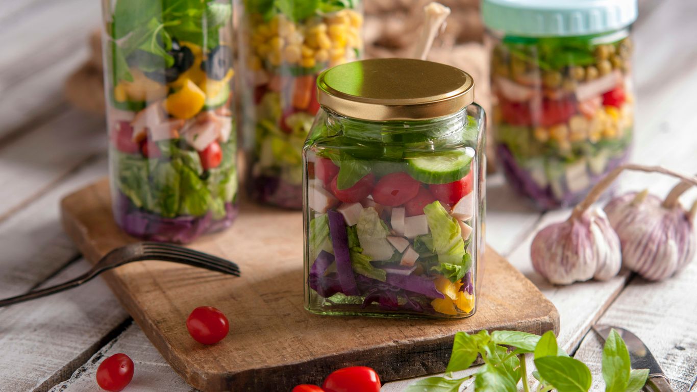 green and clear glass jar