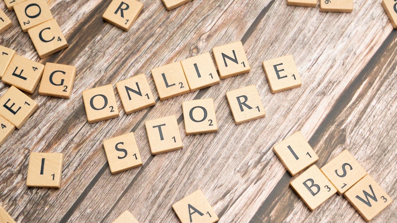 scrabble letters spelling online store on a wooden surface