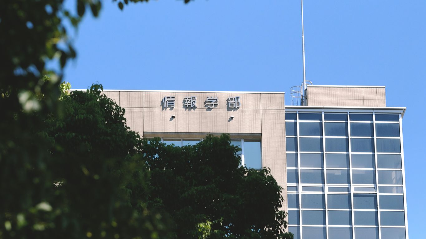 a tall building with a flag on top of it