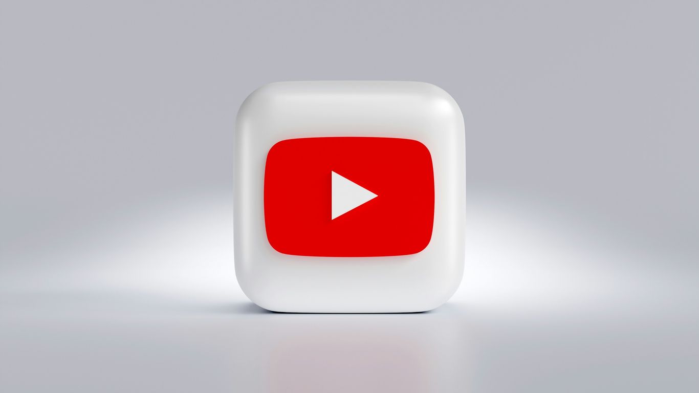 a white square button with a red arrow on it