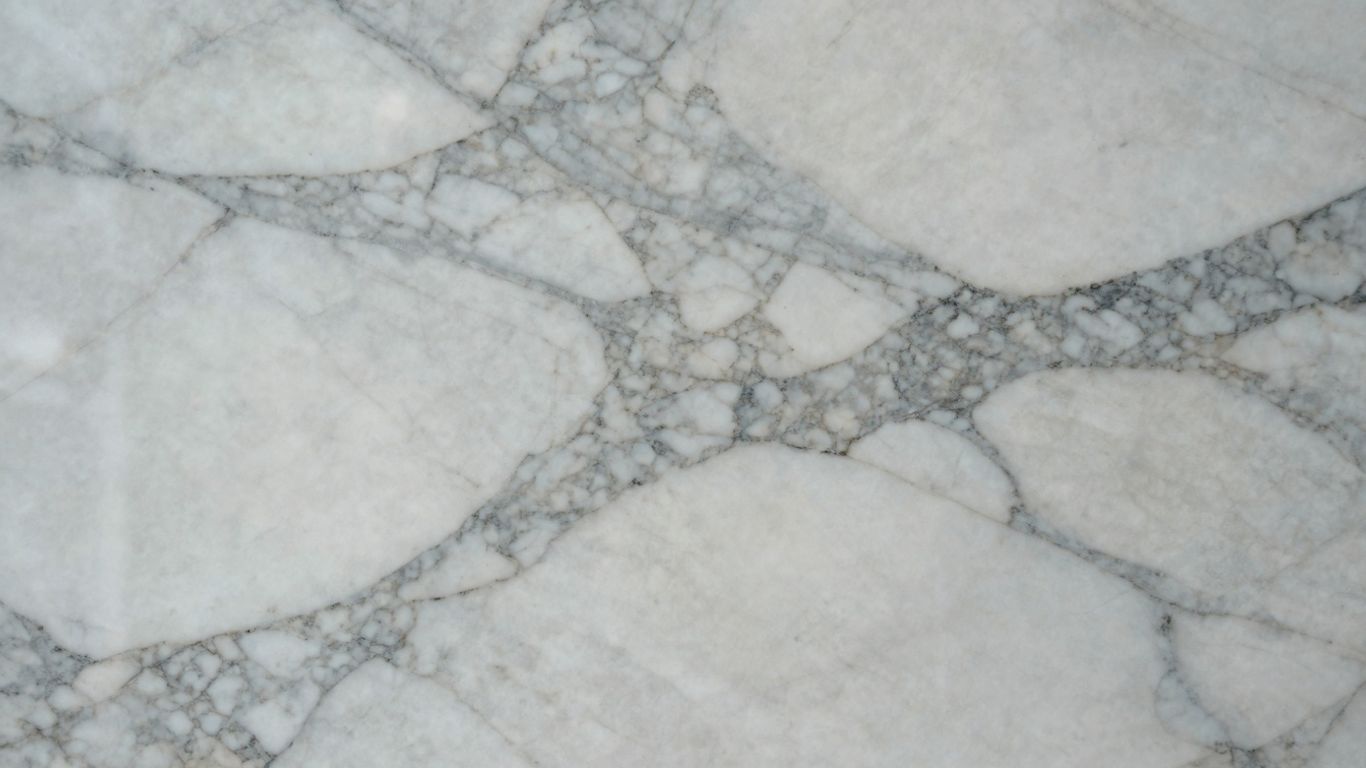 Polished Italian marble slab with grey veining.