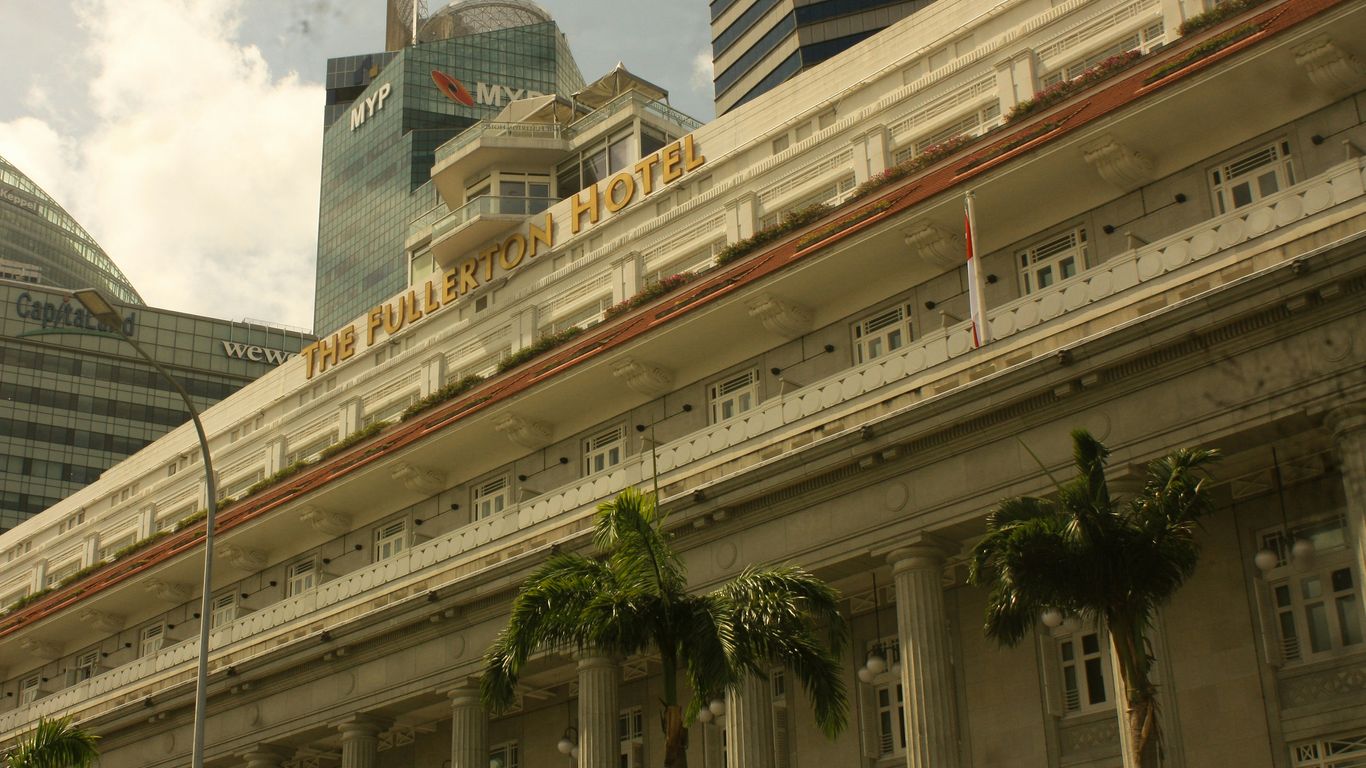 A large building with a clock tower in the background