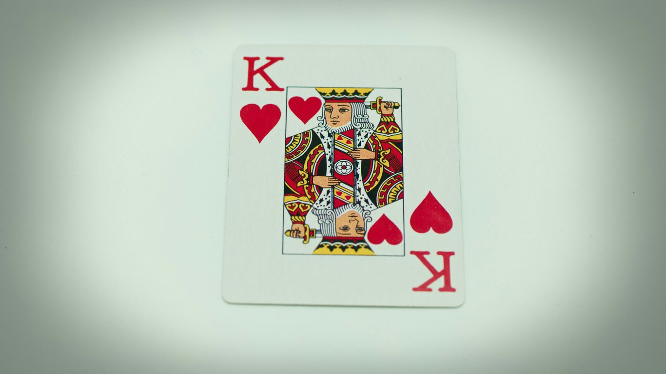a playing card with a king of hearts on it