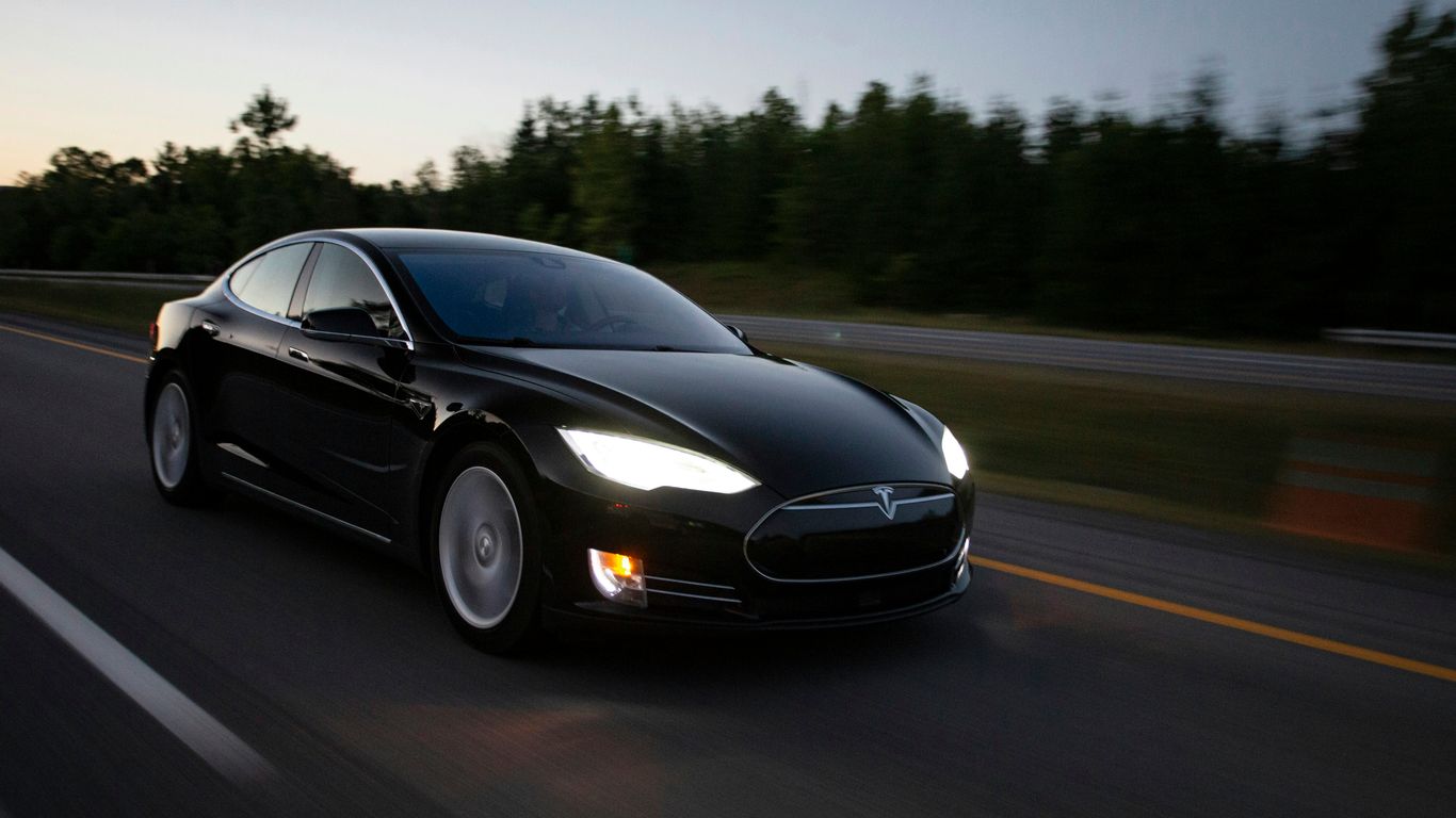 time-lapse photography of black sedan on road