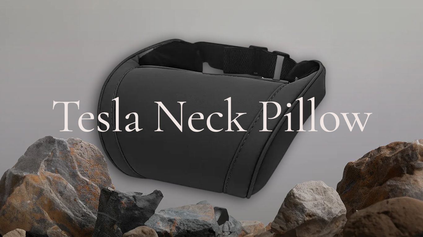 A sleek Tesla neck pillow surrounded by rocky textures.