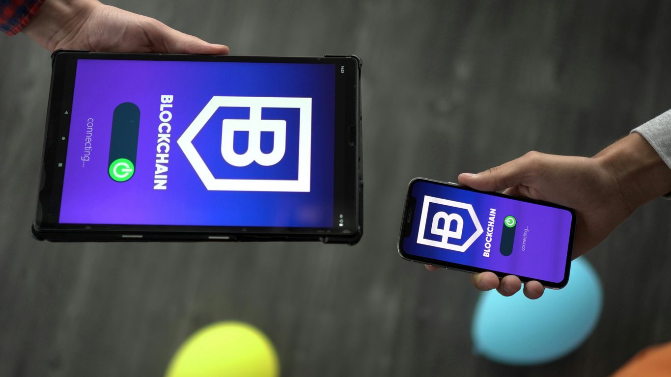 Two devices displaying a blockchain interface with connection icons.