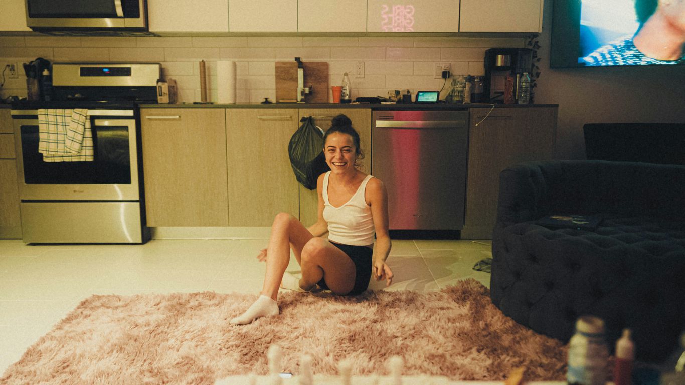 a woman sitting on the floor