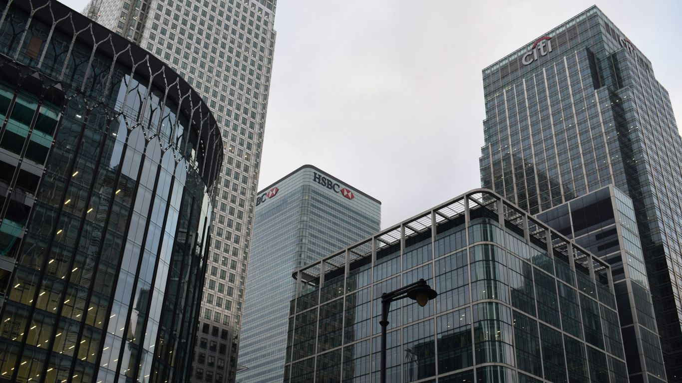 a couple of tall buildings sitting next to each other