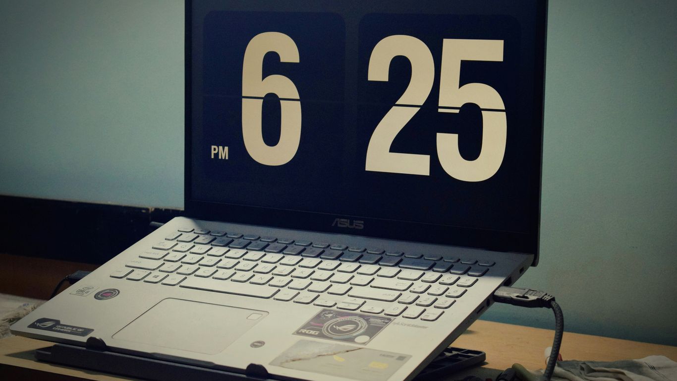Laptop displays 6:25 pm.