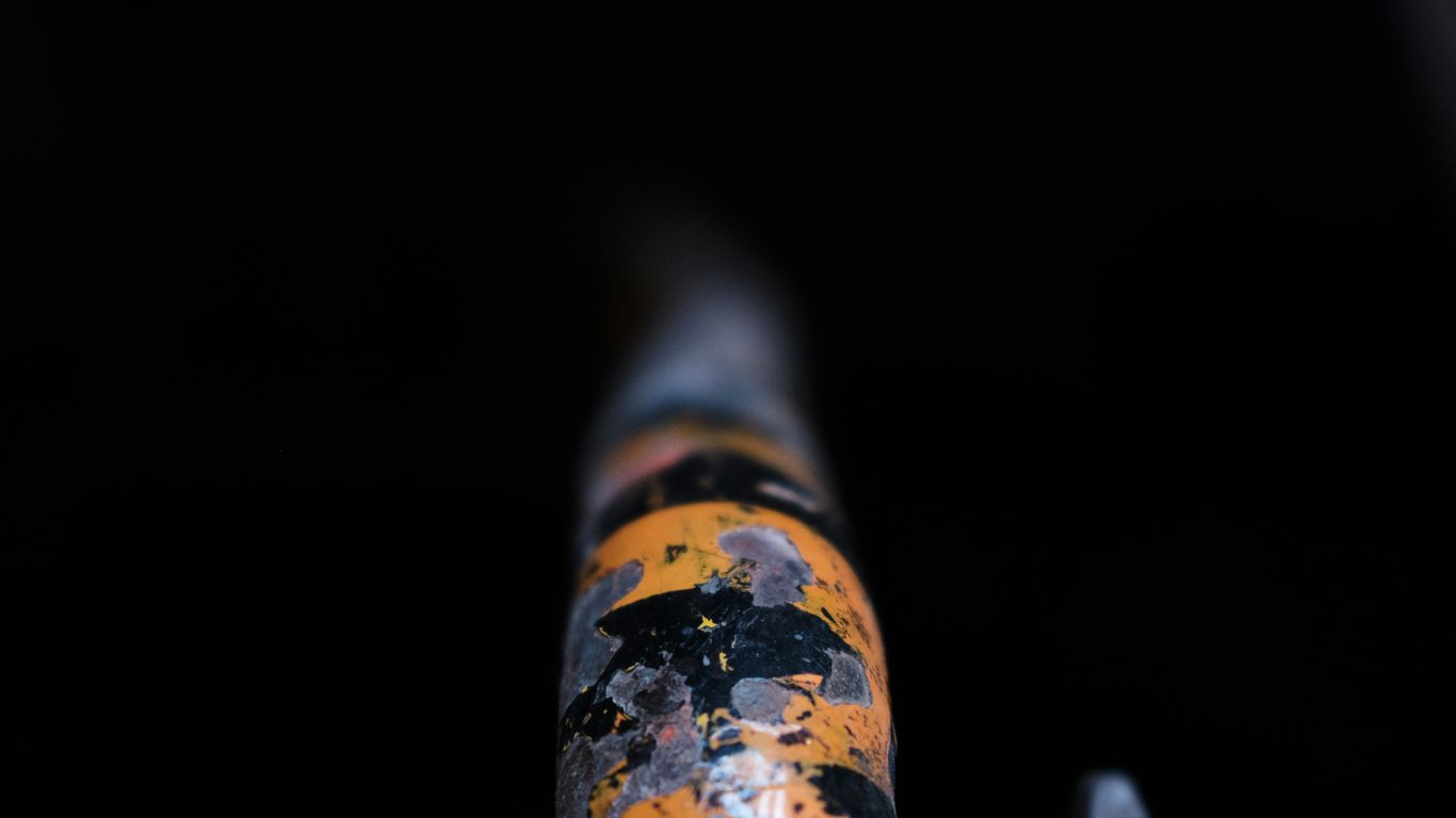 a close up of a metal object in the dark