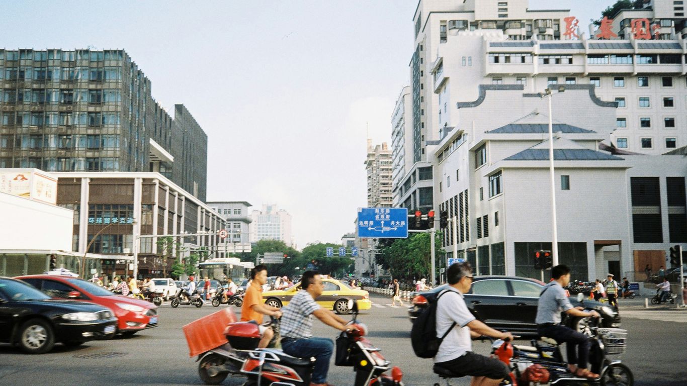 people riding motorcycle on road during daytime