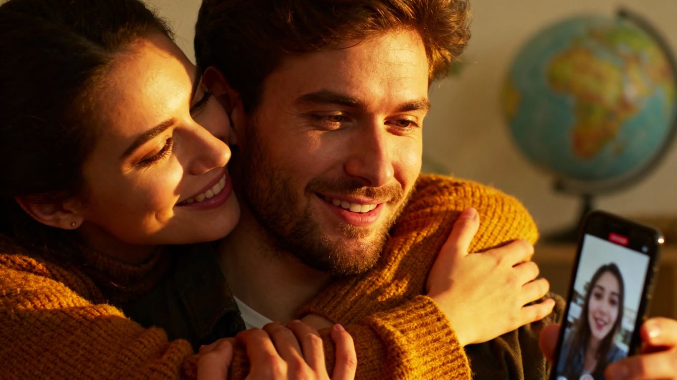 Couple on video call, maintaining long-distance relationship connection.