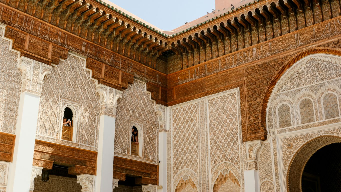 A large building with a clock tower in the background