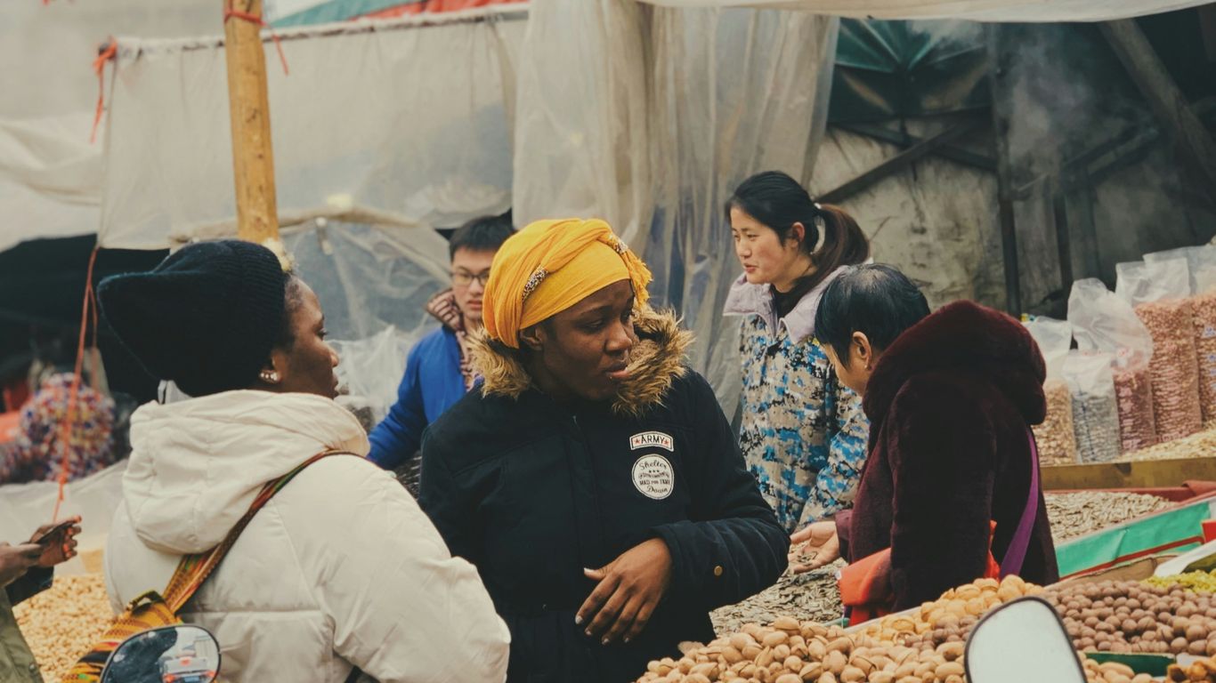 people in a market during daytime