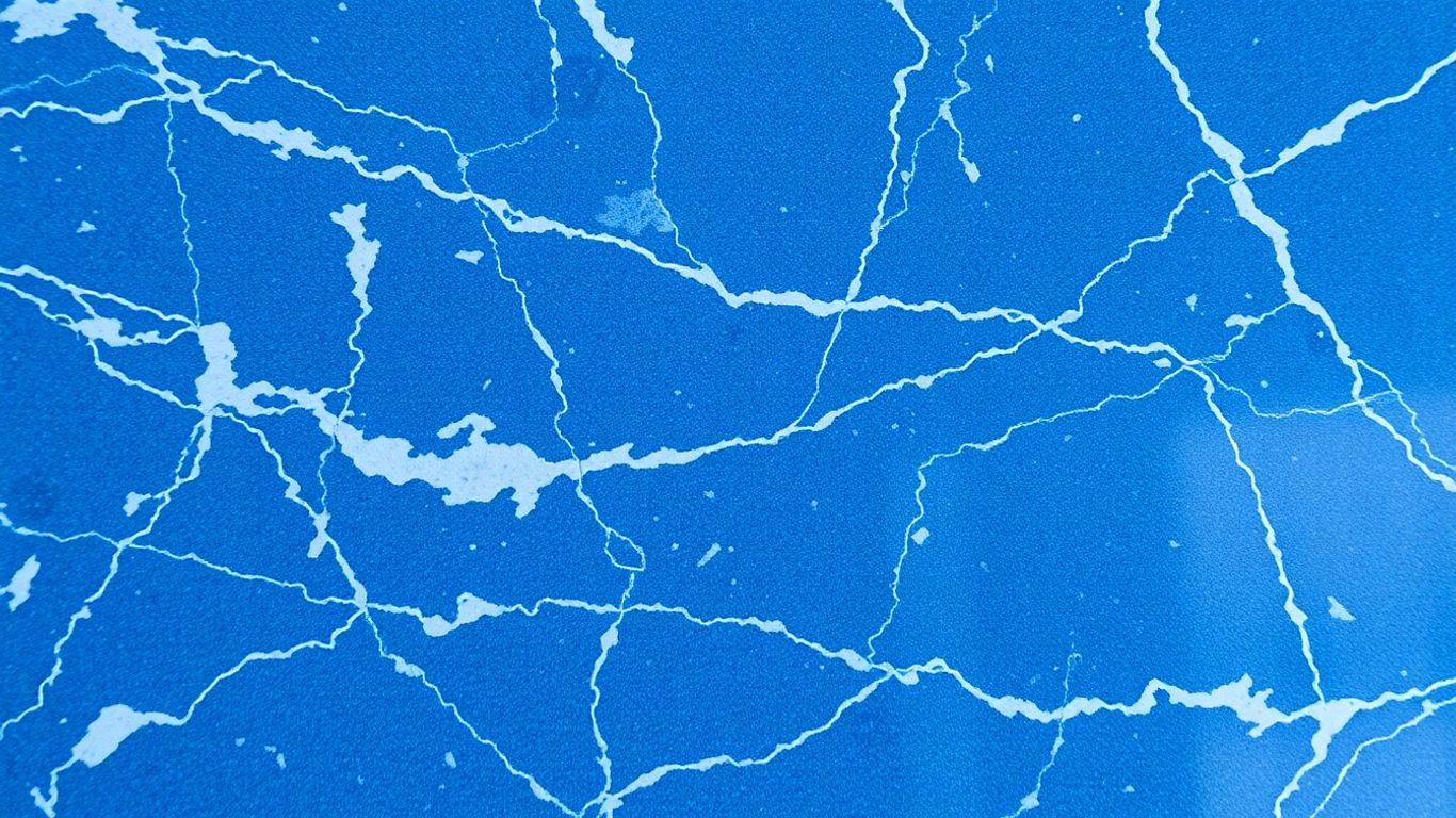 Polished bluestone marble surface with blue and grey veining.