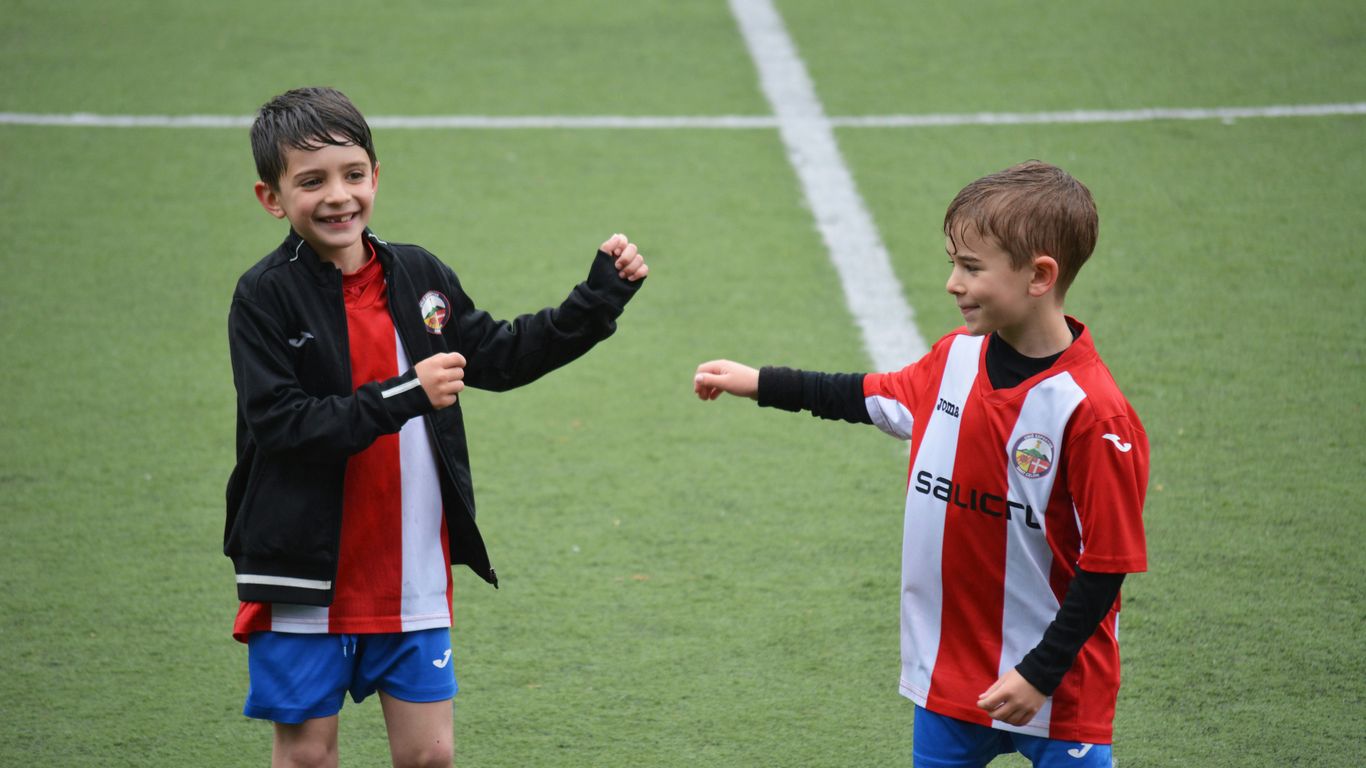 two boys in soccer field