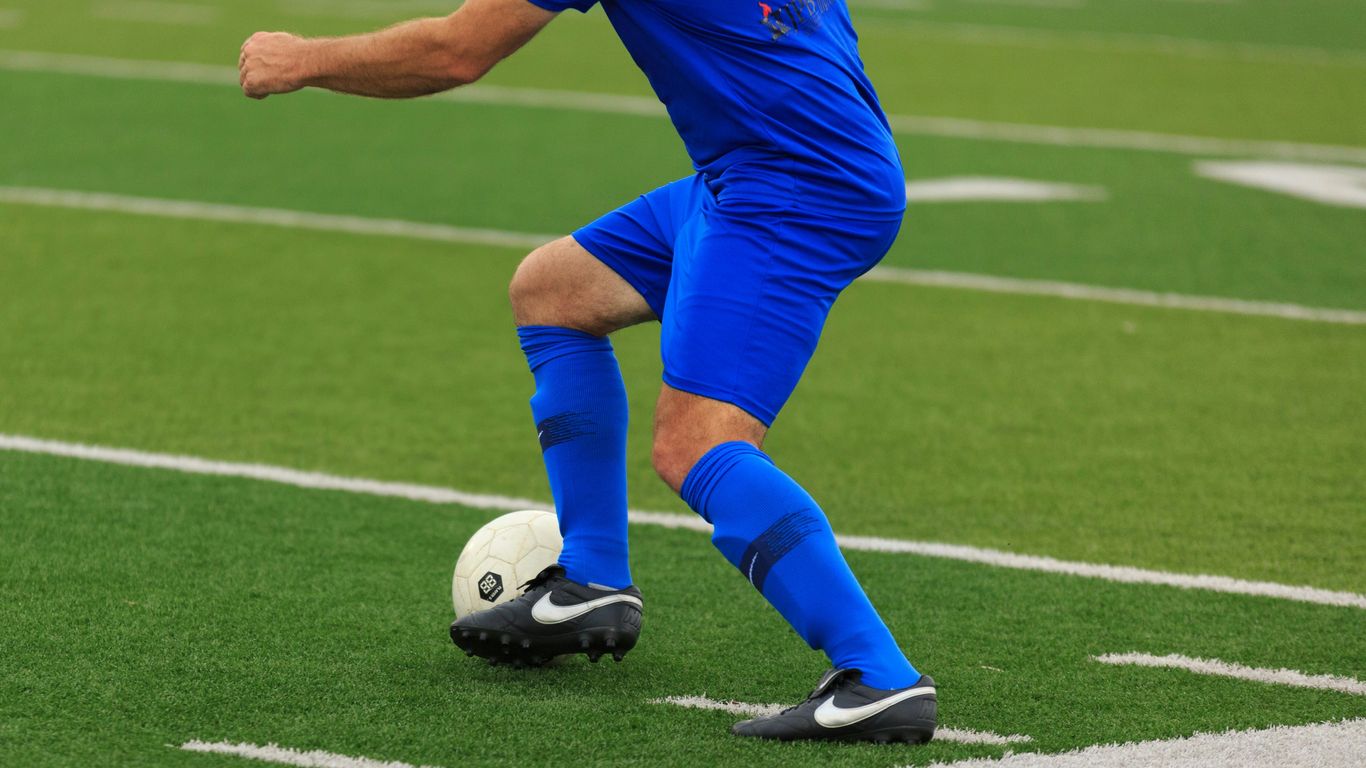 person in blue and white nike soccer jersey