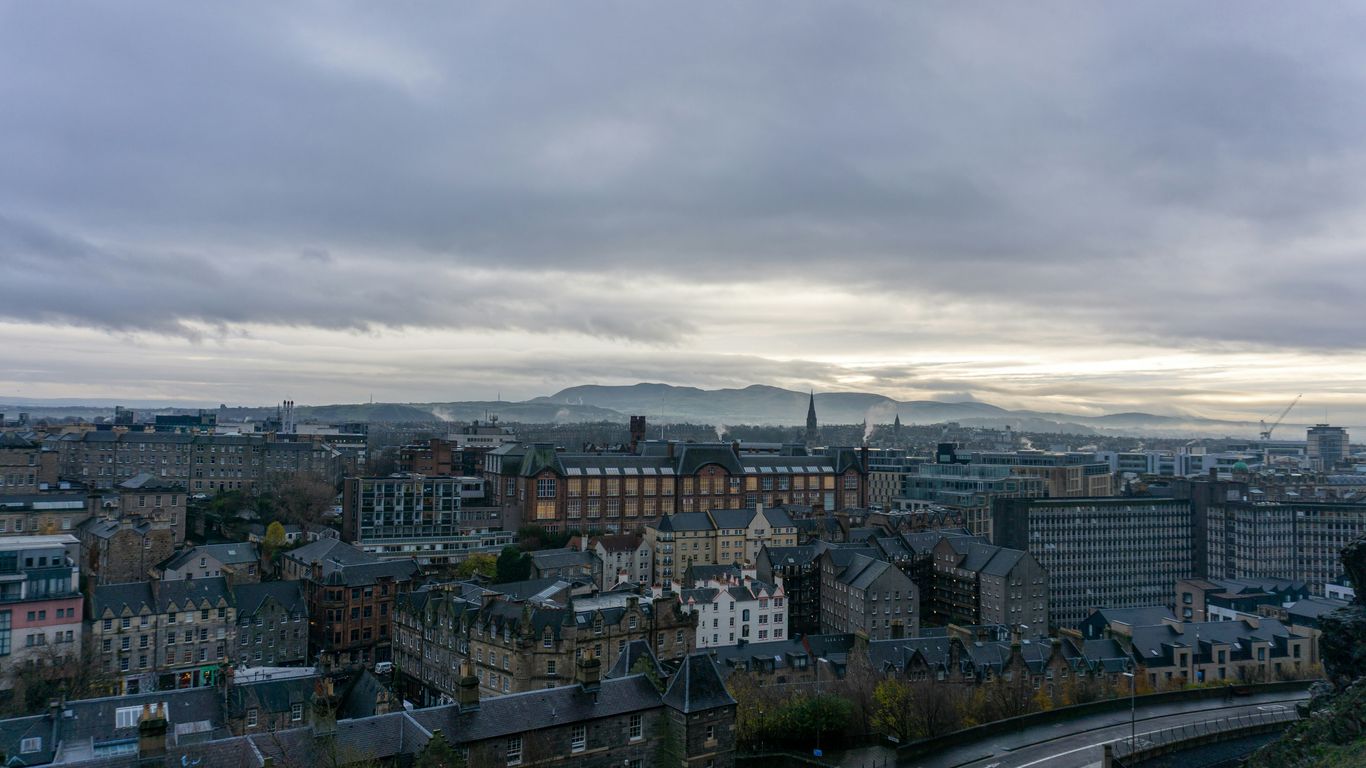a view of a city from a hill