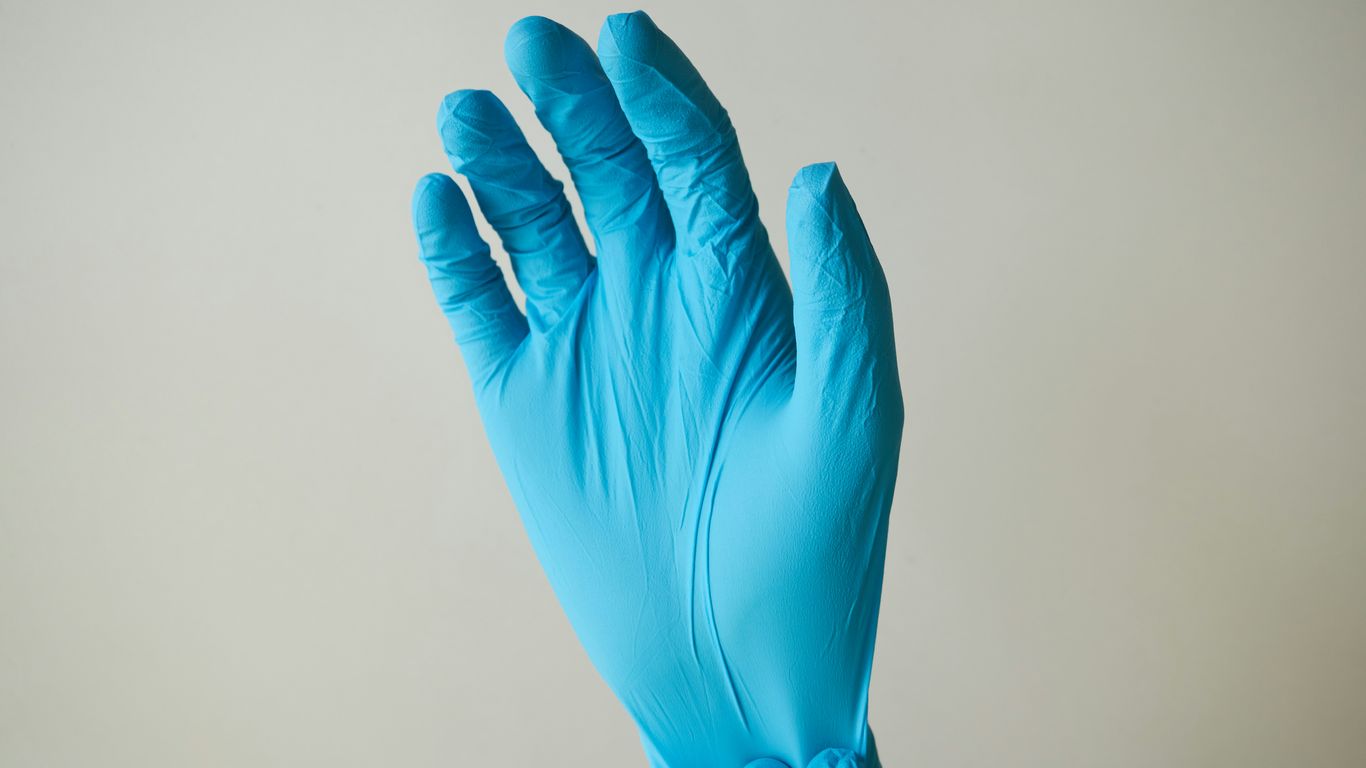 persons hand with blue light