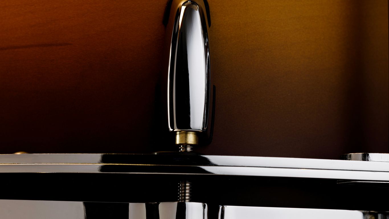 A close up of a shiny chrome sink faucet