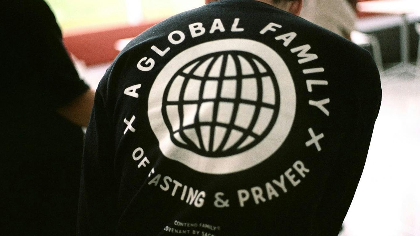 A group of people standing around a building