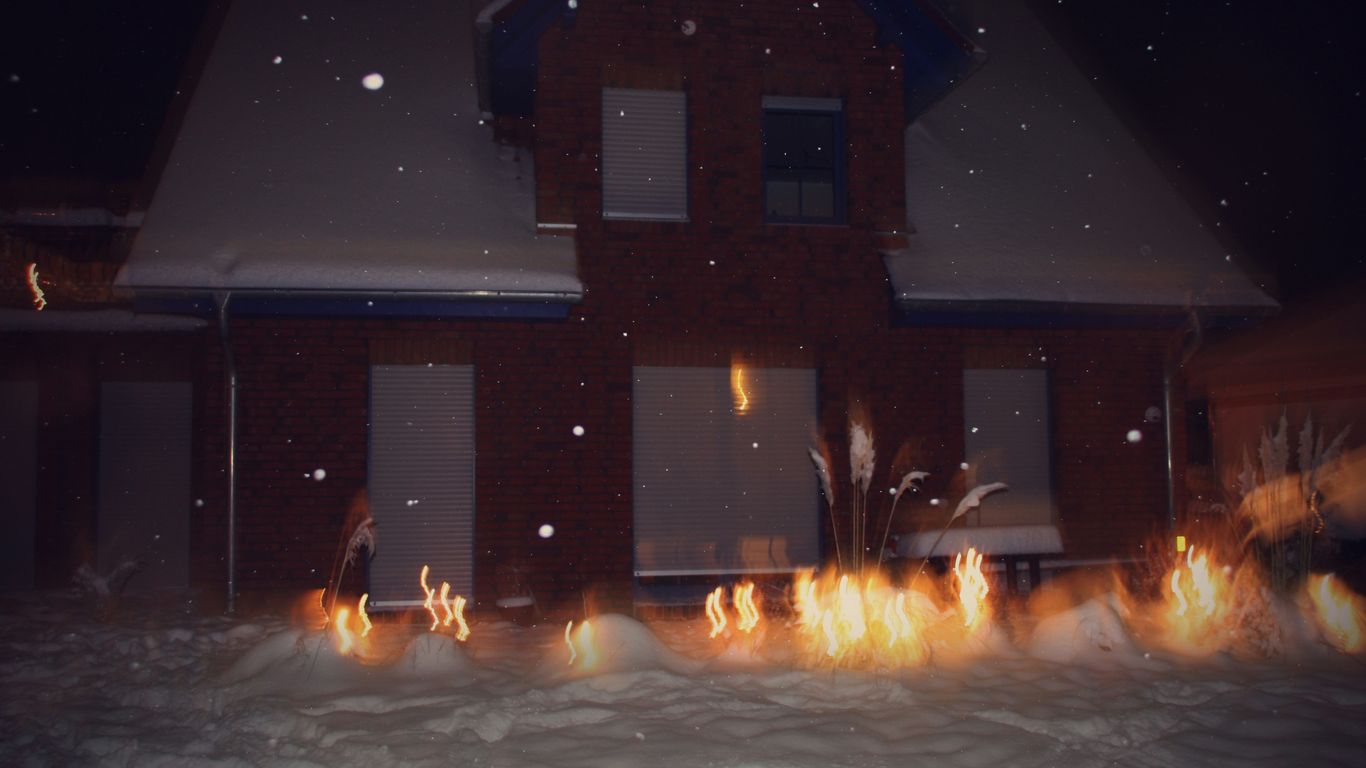 a house with a lot of fire in the front yard