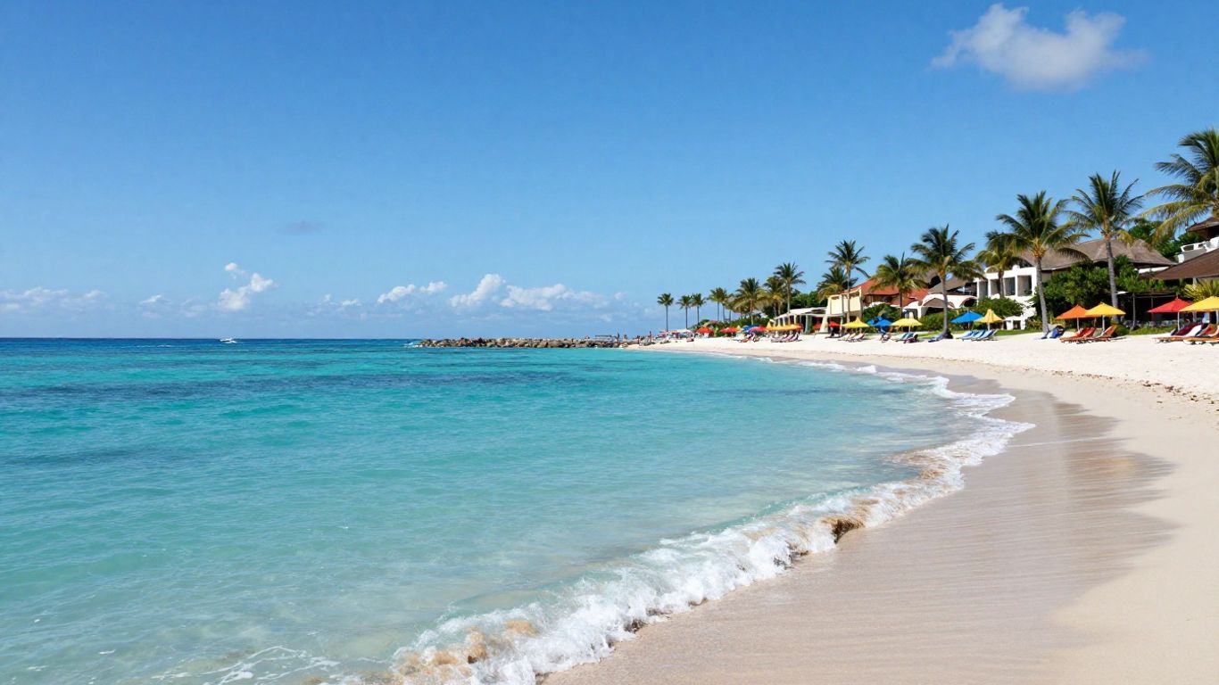 Beach with turquoise water and palm trees.