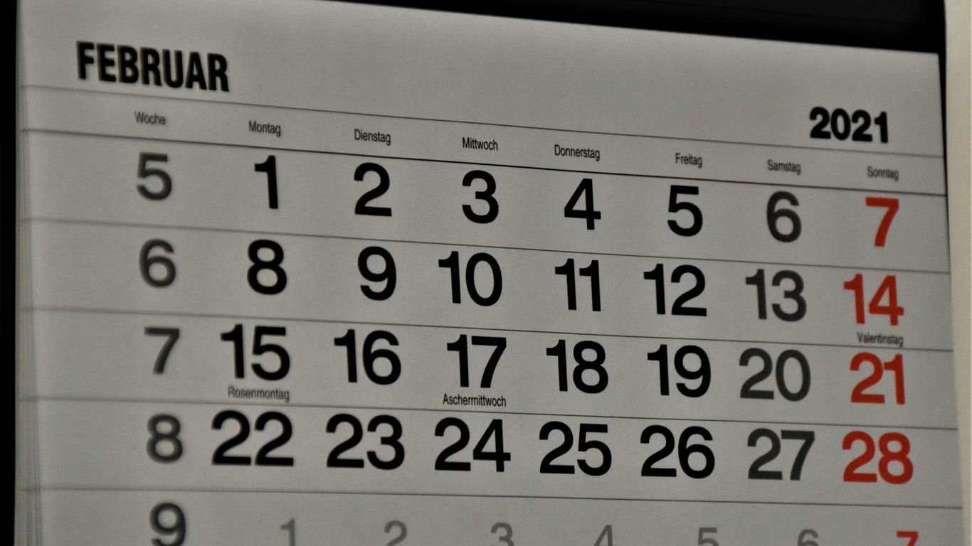 black and white calendar on white wall