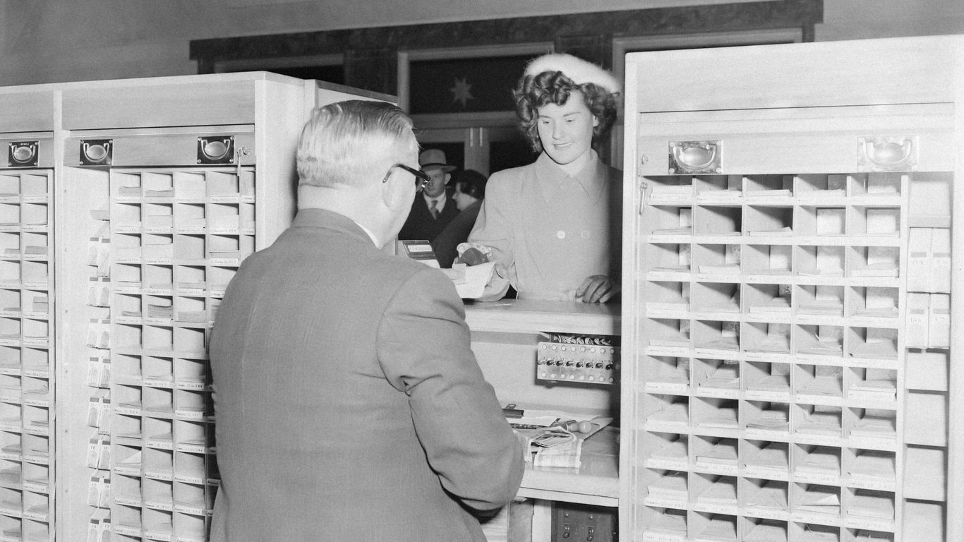 a couple of people that are standing in front of a machine