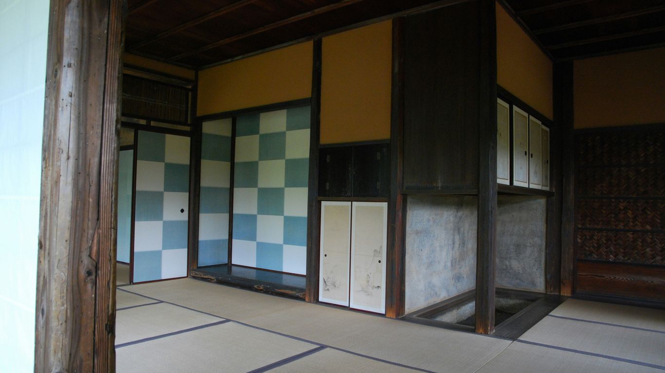 a room with a checkered floor and walls