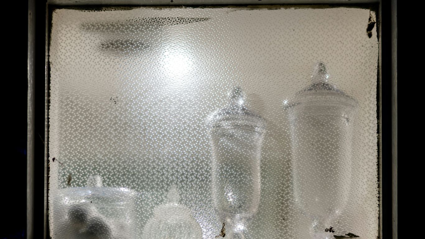 clear glass bottles on brown wooden table