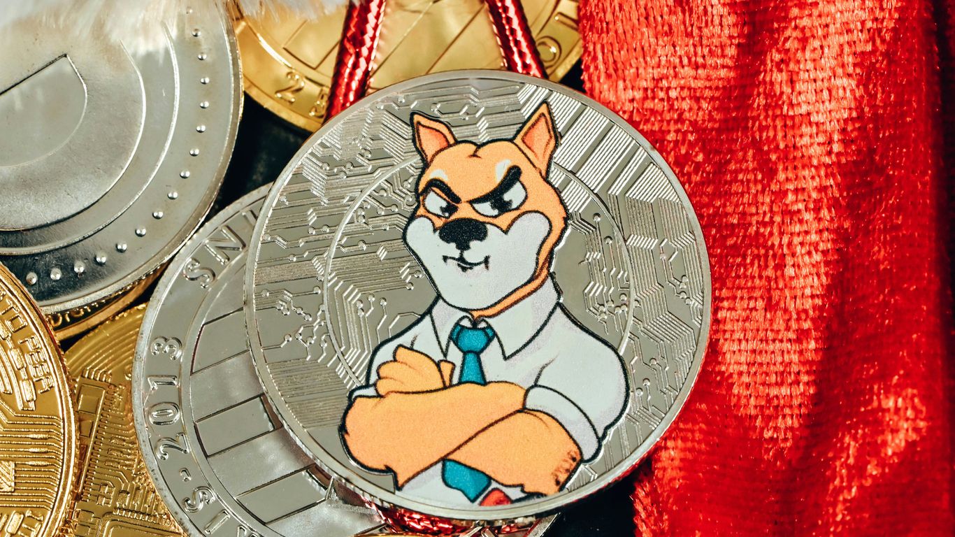 A collection of coins featuring a cartoonish dog character.