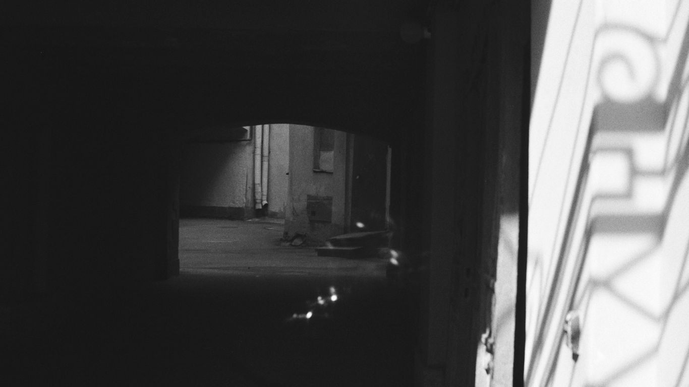 a black and white photo of a door way