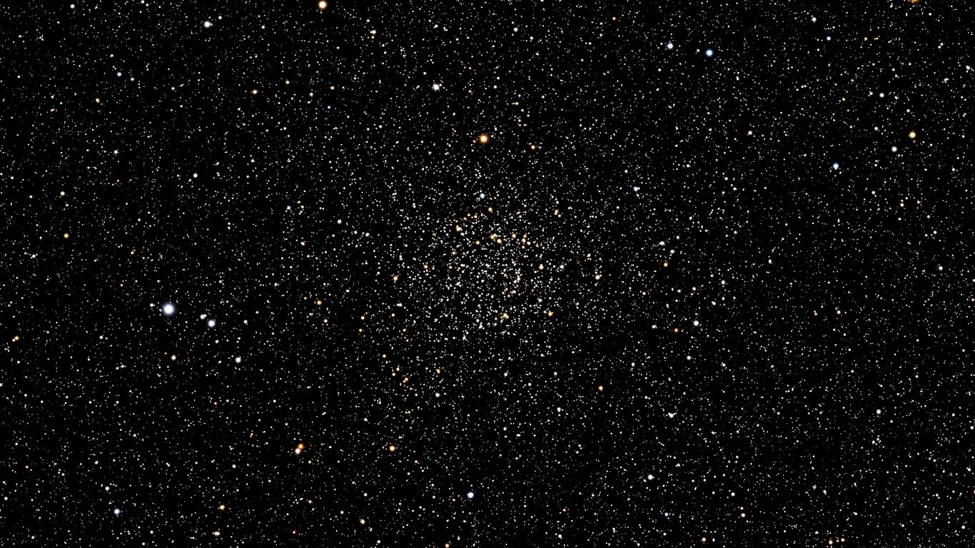A dark background with many small white sparkles.