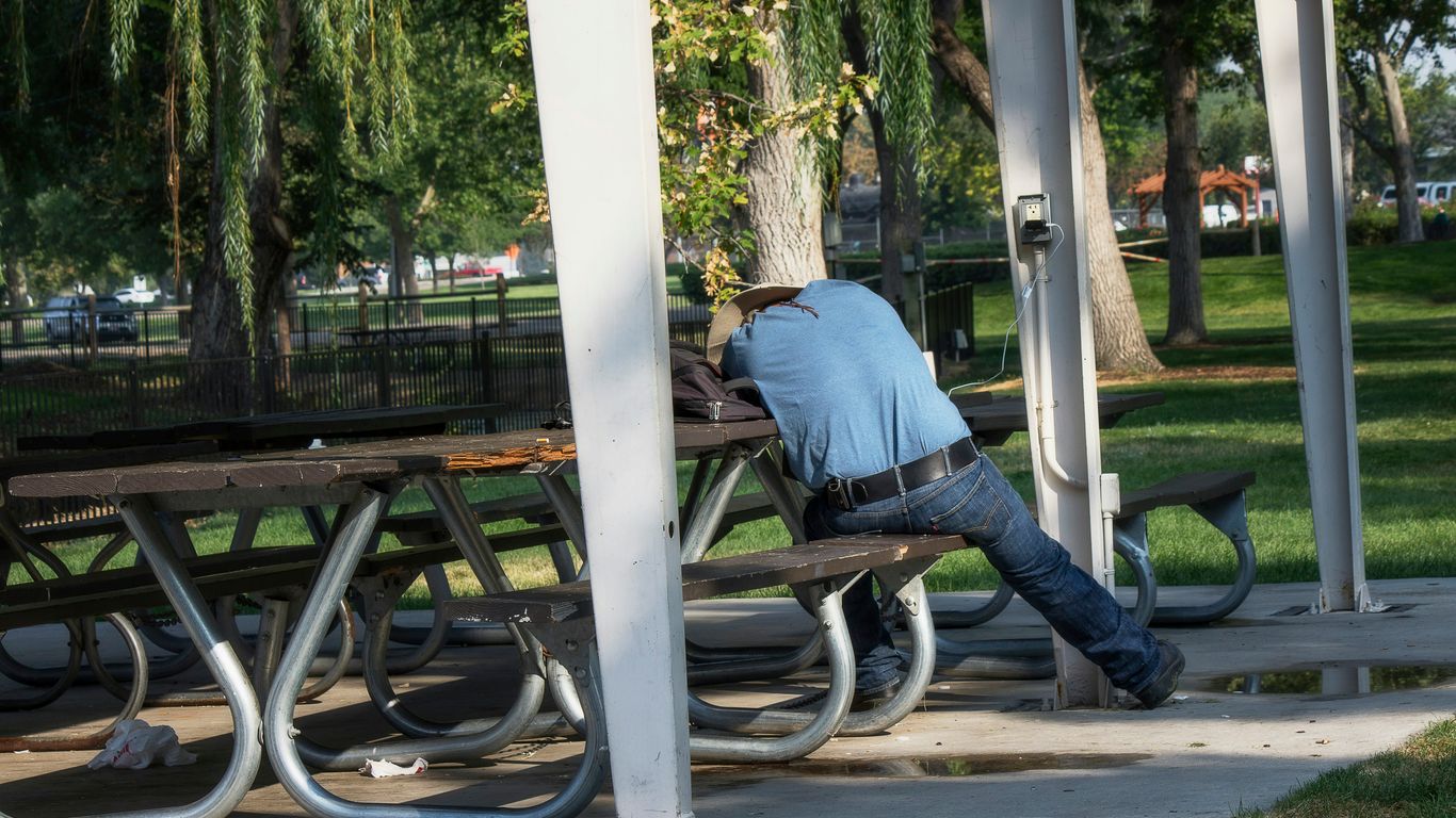 a person sleeping on a bench
