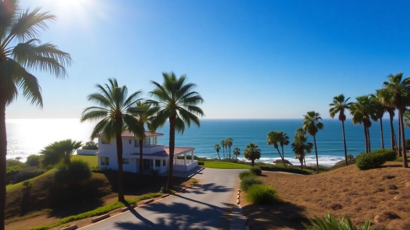 California coast with house and palm trees.